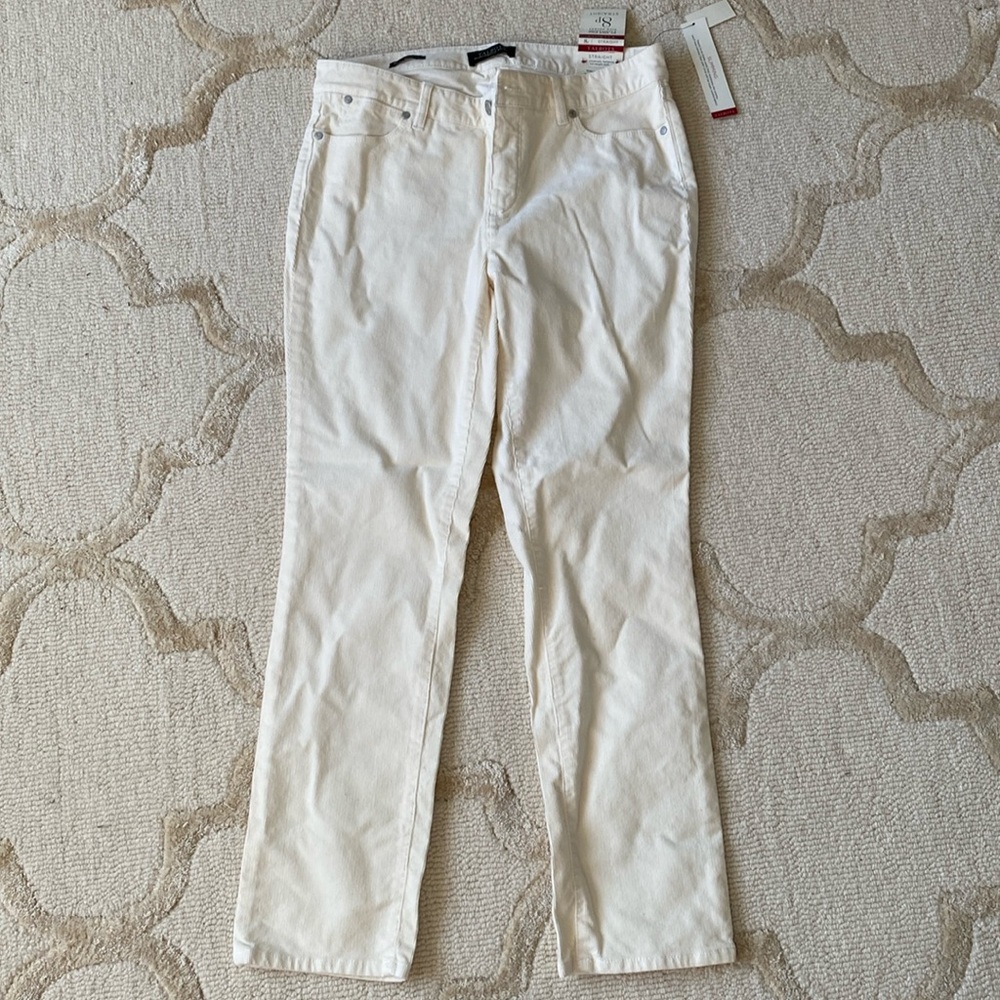 Cream colored corduroy straight leg slimming pants.
